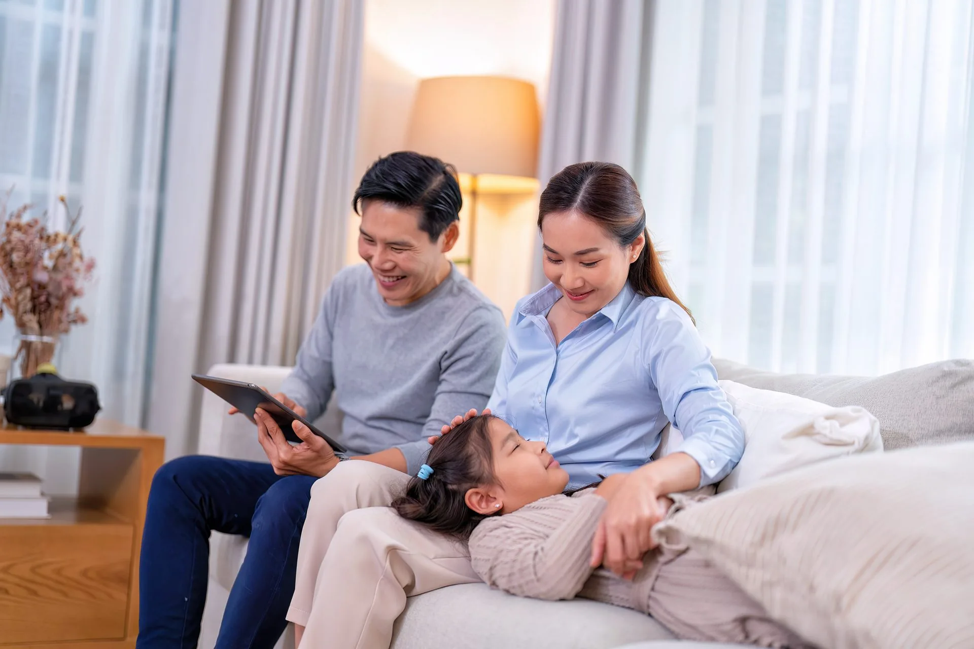 Happy family relaxing at home with comfortable heating and cooling